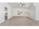 Bright living room featuring carpet, ceiling fan and view to backyard at 7664 W Karen Lee Ln, Peoria, AZ 85382