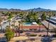 Aerial view of apartment complex with pool and mountain views at 8241 N Central Ave # 11, Phoenix, AZ 85020