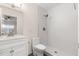Updated bathroom with walk-in shower and white vanity at 8241 N Central Ave # 11, Phoenix, AZ 85020