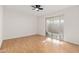 Spacious bedroom with wood flooring and sliding glass door to patio at 8241 N Central Ave # 11, Phoenix, AZ 85020