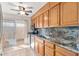 Kitchen boasts granite counters, wood cabinets, and a view to a patio at 8241 N Central Ave # 11, Phoenix, AZ 85020
