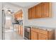 Kitchen with granite countertops, wood cabinets, and stainless steel appliances at 8241 N Central Ave # 11, Phoenix, AZ 85020