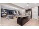 Open concept kitchen with island, dark cabinetry, and a view of the living room at 918 W Yellowstone Way, Chandler, AZ 85248