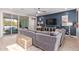 Relaxing living room with sectional sofa and sliding glass doors at 918 W Yellowstone Way, Chandler, AZ 85248