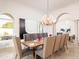 Bright dining room with a large wooden table and chandelier at 10754 E Laurel Ln, Scottsdale, AZ 85259