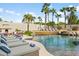 Inviting pool area with lounge chairs and a fireplace at 10754 E Laurel Ln, Scottsdale, AZ 85259