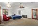 Spacious bedroom with ceiling fan, carpet flooring, and a large window at 11426 E Cottontail Rd, Cave Creek, AZ 85331