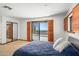 Bedroom with sliding doors leading to a private balcony and scenic views at 11426 E Cottontail Rd, Cave Creek, AZ 85331