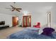 Primary bedroom with plush carpet, and access to a private balcony at 11426 E Cottontail Rd, Cave Creek, AZ 85331