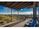 Deck with mountain views and seating for two at 11426 E Cottontail Rd, Cave Creek, AZ 85331