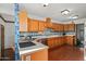 Spacious kitchen with wood cabinets, tile flooring, and stainless steel appliances at 11426 E Cottontail Rd, Cave Creek, AZ 85331