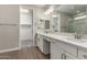 Double vanity bathroom with a walk-in shower at 11555 W Marguerite Ave, Avondale, AZ 85323