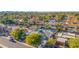Aerial view showcasing a single Gathering home with solar panels and a community pool at 12528 N 78Th St, Scottsdale, AZ 85260