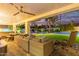 Expansive backyard oasis with covered patio, pool, and putting green at 12528 N 78Th St, Scottsdale, AZ 85260