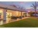 Entertain in this backyard with covered patio and putting green at 12528 N 78Th St, Scottsdale, AZ 85260