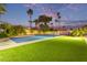 Landscaped backyard featuring a pickleball court and putting green at 12528 N 78Th St, Scottsdale, AZ 85260