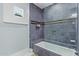 Bathroom with soaking tub and gray tile shower surround at 12528 N 78Th St, Scottsdale, AZ 85260