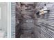 Modern shower with marble-look walls and rainfall shower head at 12528 N 78Th St, Scottsdale, AZ 85260