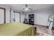 Bright bedroom featuring a king-size bed and built-in shelving at 12528 N 78Th St, Scottsdale, AZ 85260