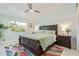 Spacious bedroom with large bed, ceiling fan, and rug at 12528 N 78Th St, Scottsdale, AZ 85260