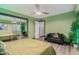 Relaxing bedroom with a black leather couch and green walls at 12528 N 78Th St, Scottsdale, AZ 85260