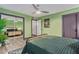Green-walled bedroom with mirrored closet and sitting area at 12528 N 78Th St, Scottsdale, AZ 85260