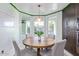 Bright breakfast nook with round table and pool view at 12528 N 78Th St, Scottsdale, AZ 85260