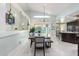 Open concept dining area, adjacent to kitchen and pool view at 12528 N 78Th St, Scottsdale, AZ 85260