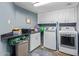 Convenient laundry room with washer, dryer, and counter space at 12528 N 78Th St, Scottsdale, AZ 85260