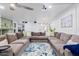 Relax in this large living room with sectional sofa and projector at 12528 N 78Th St, Scottsdale, AZ 85260