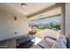 Spacious backyard with artificial turf, firepit, and patio at 12657 W Myrtle Ave, Glendale, AZ 85307