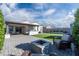 Spacious backyard, covered patio, and fire pit at 12657 W Myrtle Ave, Glendale, AZ 85307