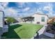 Artificial turf lawn, covered patio, and built-in BBQ at 12657 W Myrtle Ave, Glendale, AZ 85307