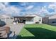 Large backyard with covered patio and artificial turf at 12657 W Myrtle Ave, Glendale, AZ 85307