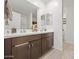 Double vanity bathroom with modern dark brown cabinets at 12657 W Myrtle Ave, Glendale, AZ 85307