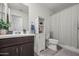 Clean bathroom with a toilet, shower/tub combo and vanity at 12657 W Myrtle Ave, Glendale, AZ 85307