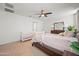 Bright bedroom with a crib and a bed with guard rails at 12657 W Myrtle Ave, Glendale, AZ 85307