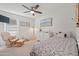 Bright bedroom with a comfortable bed, rocking chair, and plenty of natural light at 12657 W Myrtle Ave, Glendale, AZ 85307