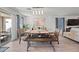 Bright dining area with wood table and bench seating at 12657 W Myrtle Ave, Glendale, AZ 85307