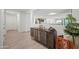 Bright entryway with wood-look flooring and built-in storage at 12657 W Myrtle Ave, Glendale, AZ 85307