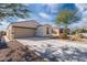 Single story home with driveway and desert landscaping at 12657 W Myrtle Ave, Glendale, AZ 85307