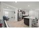 Modern kitchen with island, stainless steel appliances, and breakfast bar at 12657 W Myrtle Ave, Glendale, AZ 85307