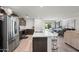 Modern kitchen with island and stainless steel appliances at 12657 W Myrtle Ave, Glendale, AZ 85307