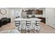 Kitchen island with seating for three, white countertops at 12657 W Myrtle Ave, Glendale, AZ 85307