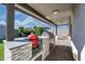 Outdoor kitchen with built-in grill and granite countertop at 12657 W Myrtle Ave, Glendale, AZ 85307