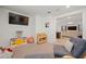Bright playroom with a view into the living area, comfy seating at 12657 W Myrtle Ave, Glendale, AZ 85307