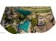 Aerial view of a community with a pool, golf course, and lake at 13612 W Cypress St, Goodyear, AZ 85395