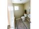 Small bathroom with toilet and pedestal sink at 13612 W Cypress St, Goodyear, AZ 85395