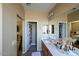 Bathroom with double sinks and linen closet at 13612 W Cypress St, Goodyear, AZ 85395