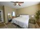 Spacious bedroom with king-size bed and ensuite bathroom at 13612 W Cypress St, Goodyear, AZ 85395